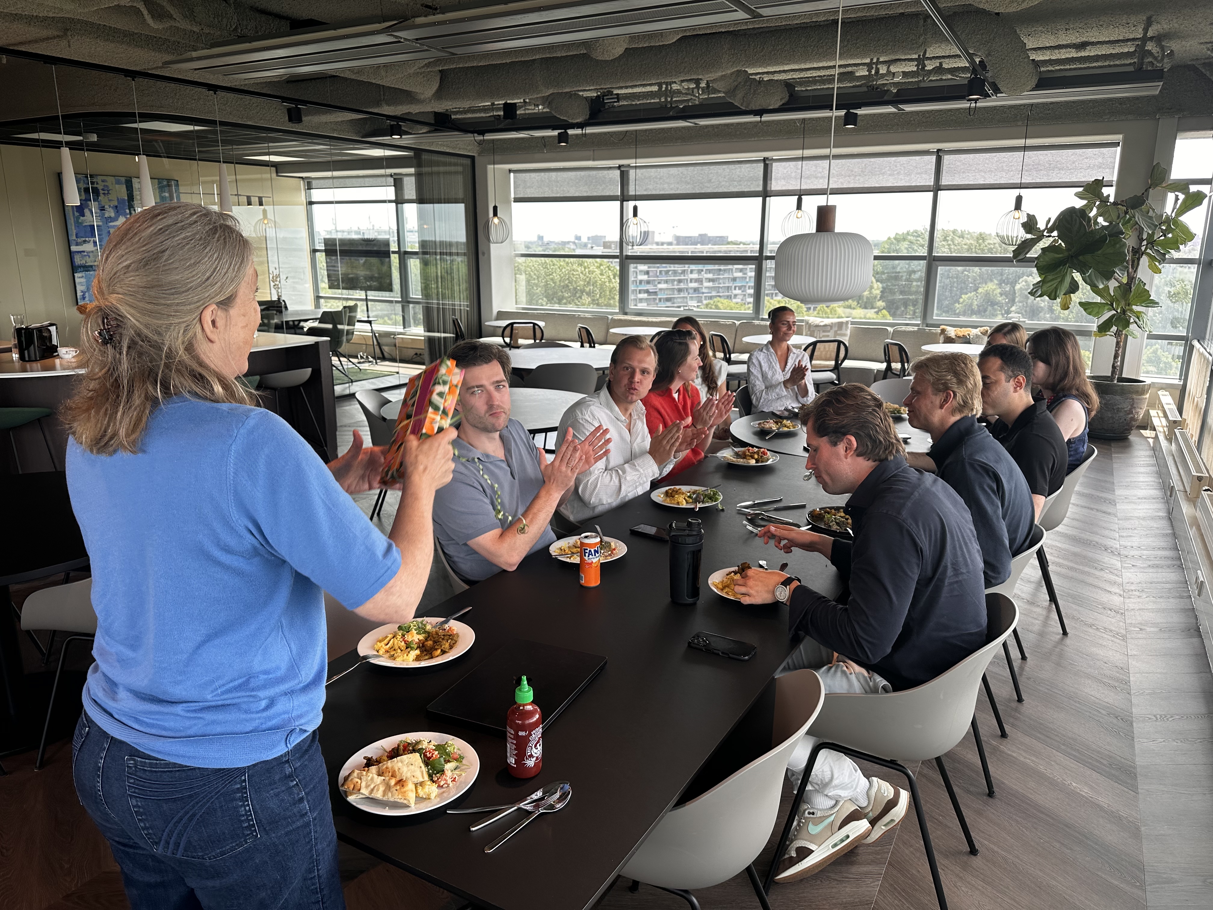 The whole team eating together at one long table
