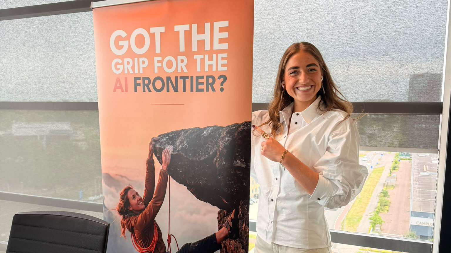 A WAIMAKER next to the 'Got the grip for the AI frontier?' banner in the office