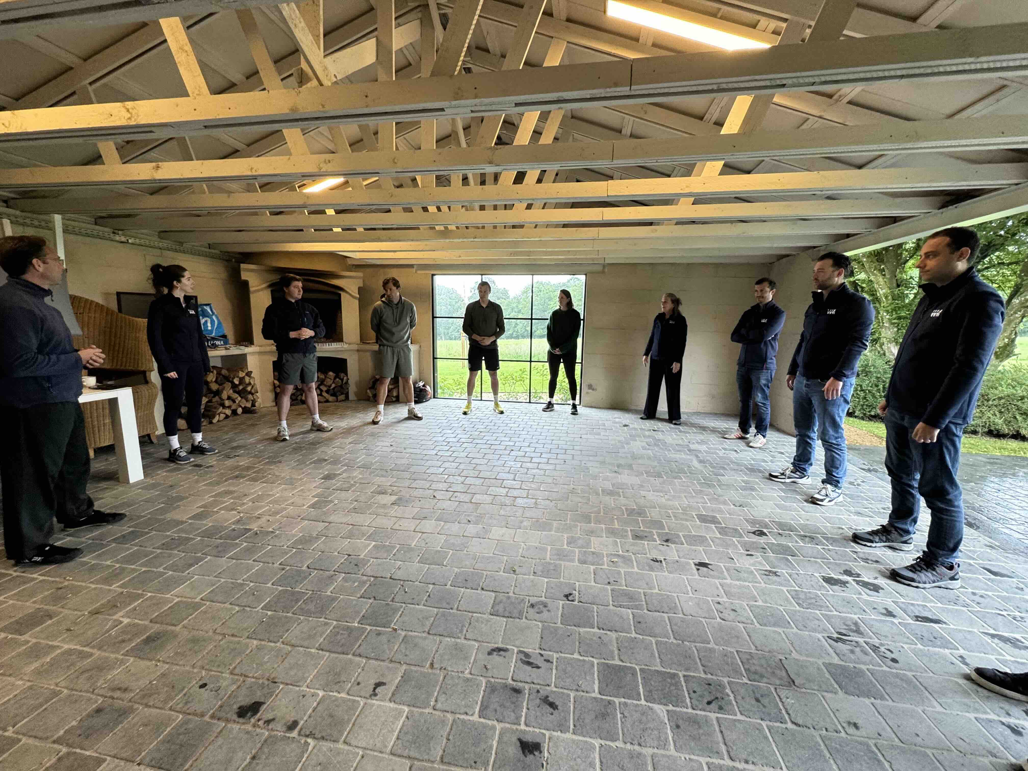 The team gathered in a circle for tai chi at the off-site